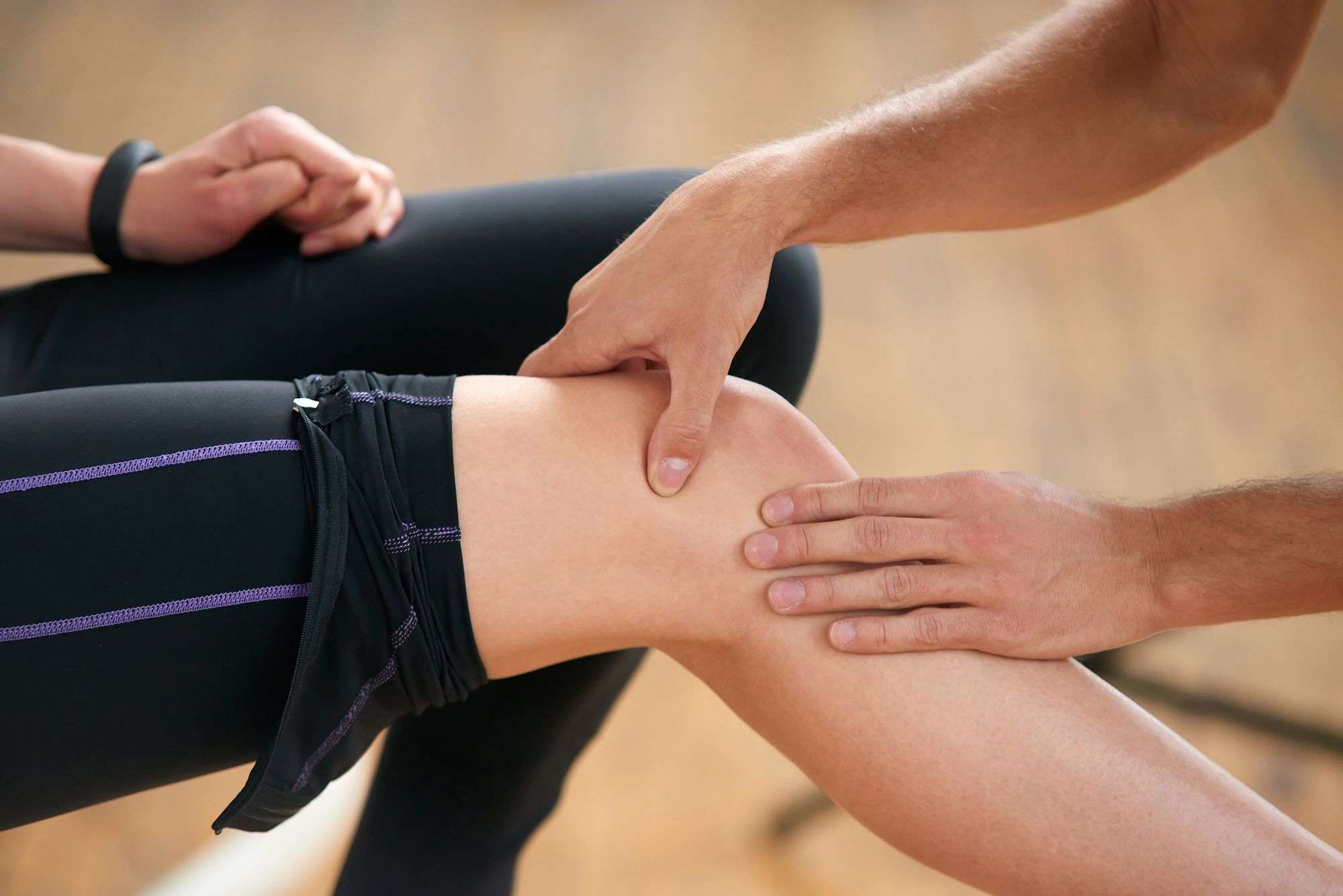 Close up woman feeling pain in knee.