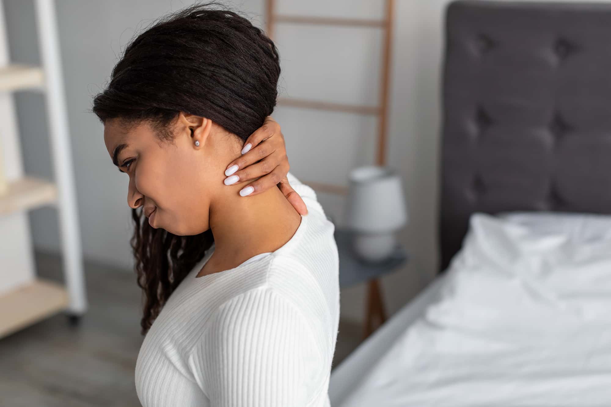 portrait-of-black-woman-with-neck-pain-sitting-on-2021-09-03-03-15-54-utc